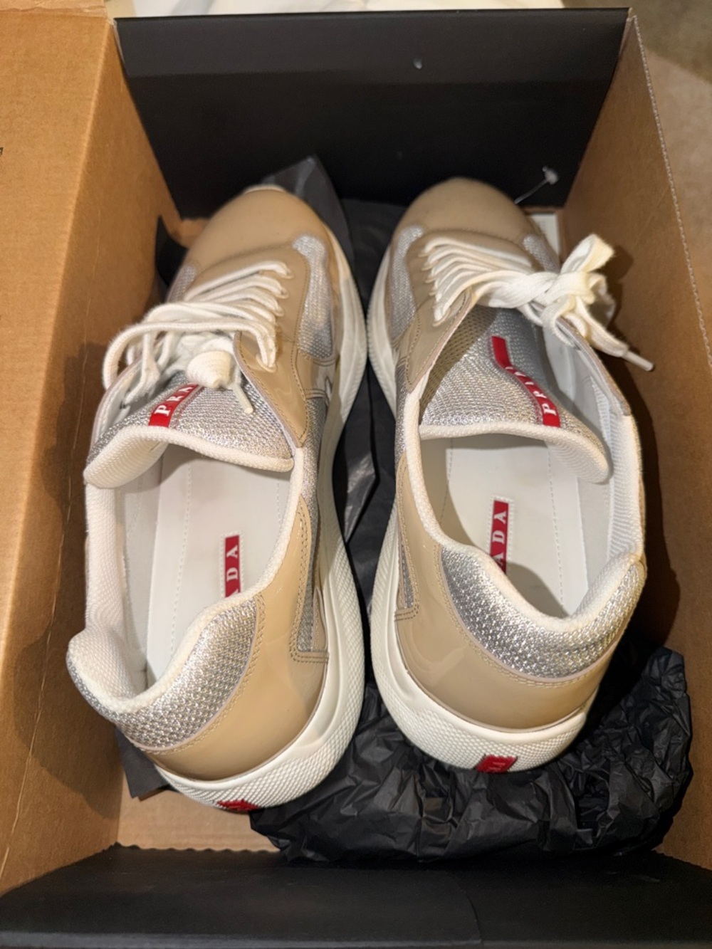 Prada Beige, Silver & White Low-Top Sneakers with Red Logo Tabs